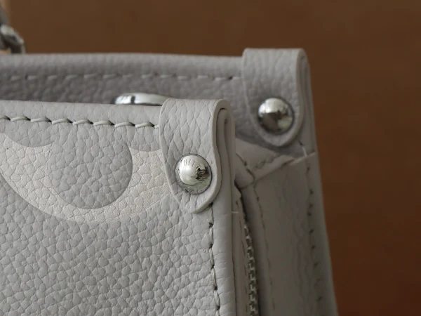 OnTheGo East West Bicolour Monogram Empreinte Leather - Image 9