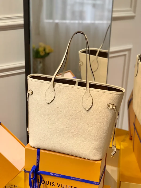 Neverfull MM Monogram Empreinte Leather Handbags
