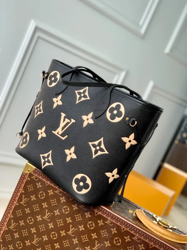 Neverfull MM Monogram Empreinte Leather Handbags
