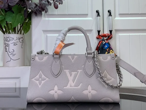 OnTheGo East West Bicolor Monogram Empreinte Leather