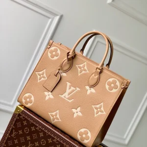 OnTheGo MM Bicolor Monogram Empreinte Leather Handbags