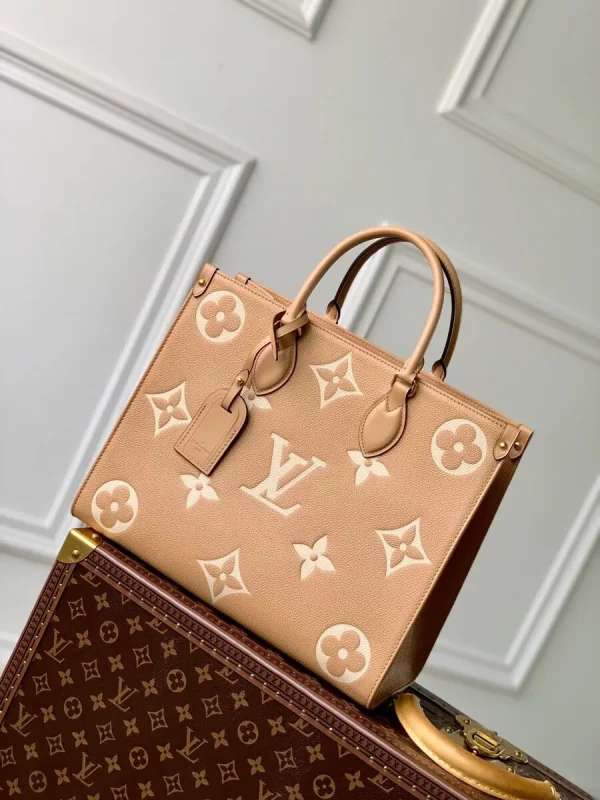 OnTheGo MM Bicolor Monogram Empreinte Leather Handbags