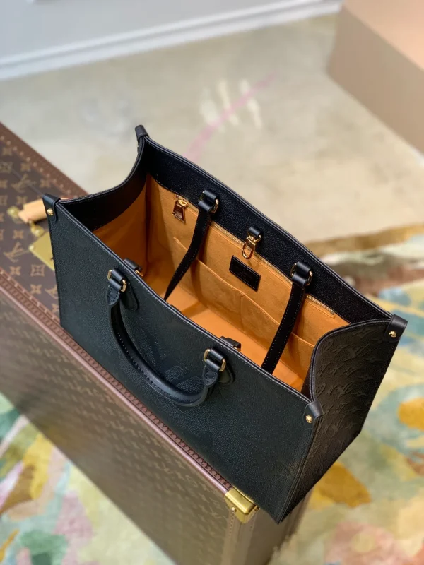 OnTheGo MM Monogram Empreinte Leather Handbags - Image 10