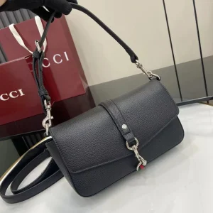 Small crossbody bag with hook closure in black leather